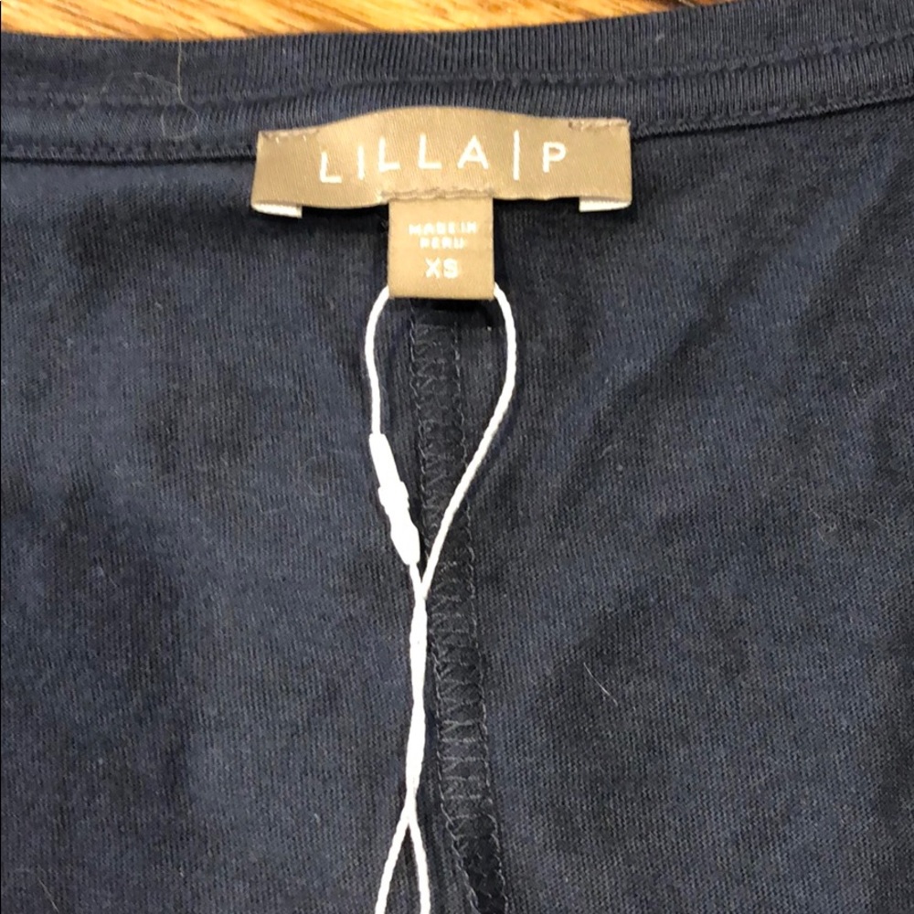 Navy women’s too with short sleeve detail.